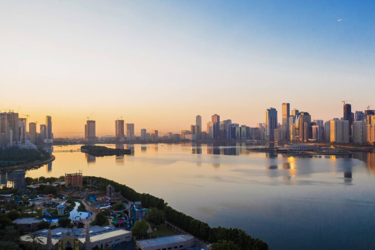 Sharjah aerial city skyline view with water