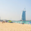 Dubai beach sand, sun and water with Burj Al Arab