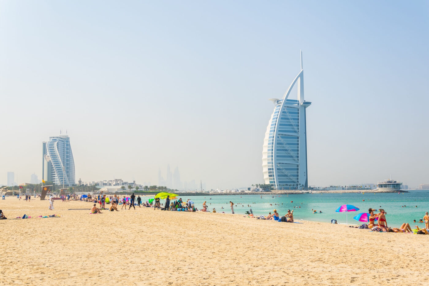 Dubai beach sand, sun and water with Burj Al Arab