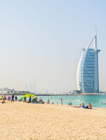 Dubai beach sand, sun and water with Burj Al Arab